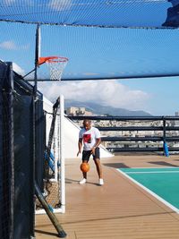 Man playing basketball on cruise ship