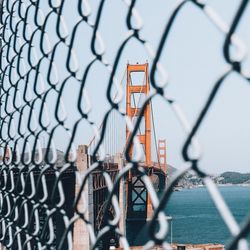 Close-up of basketball hoop against sky