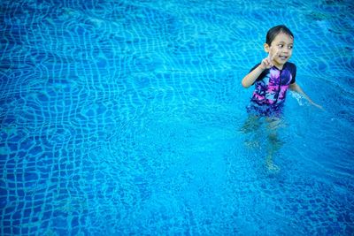 High angle view of woman swimming in pool