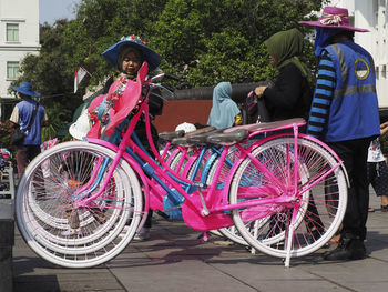 People riding bicycle on street