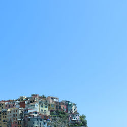 Low angle view of buildings against blue sky