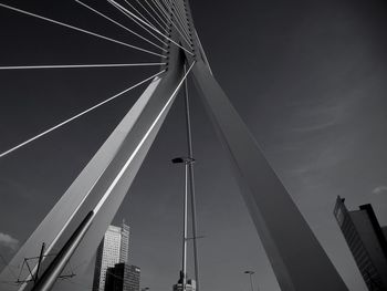 Low angle view of suspension bridge against sky