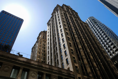 Low angle view of modern buildings against sky in city