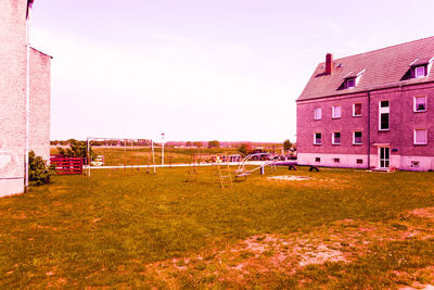 Buildings in city against clear sky