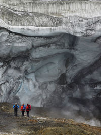 Three friends exploring the glacier at hrafntinnusker