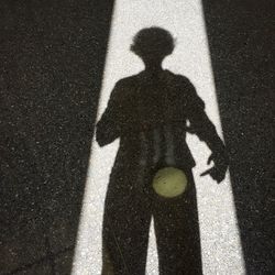 High angle view of silhouette shadow on man