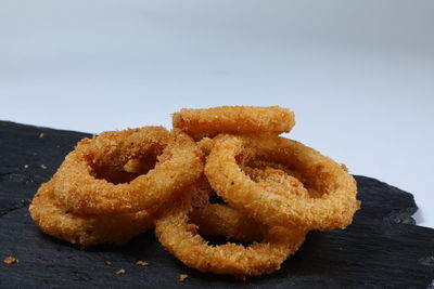 Close-up of served food on table against gray background