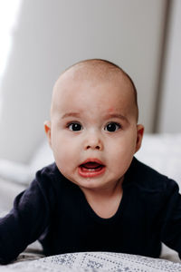 Portrait of cute baby boy at home