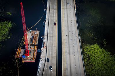 High angle view of railroad tracks by road in city