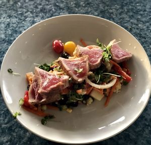 High angle view of vegetables in plate on table