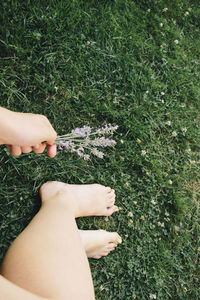 Low section of woman legs on field