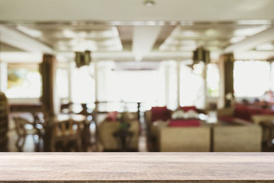 Empty chairs and tables in restaurant