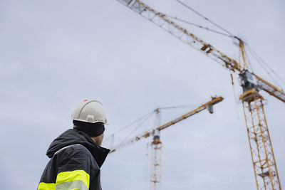 Engineer using standing at building site