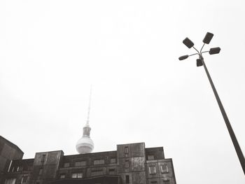 Low angle view of fernsehturm tower against sky