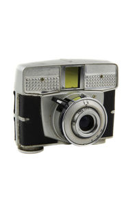 Close-up of camera over white background