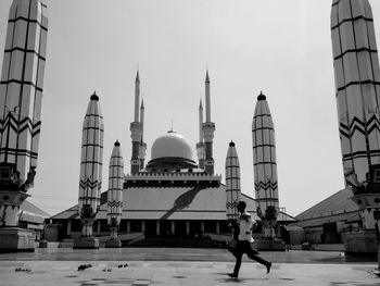 View of buildings in city against clear sky