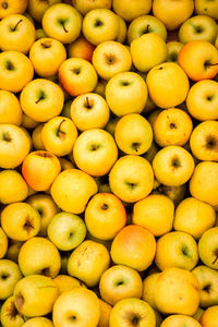Crate of yellow apples