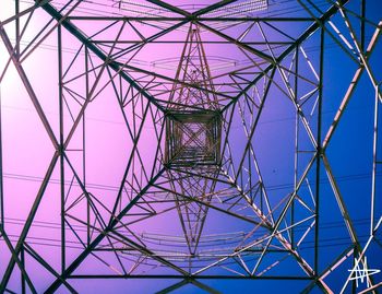 Low angle view of electricity pylon against sky