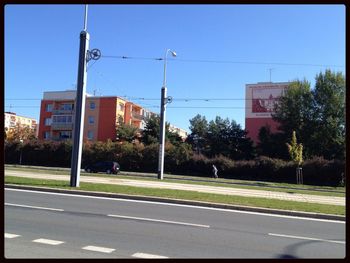 Road with buildings in background