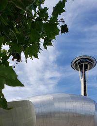 Low angle view of building against cloudy sky