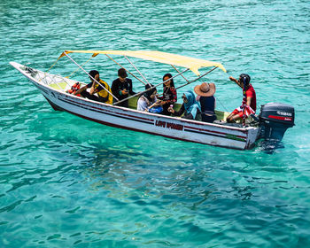 People in boat on sea