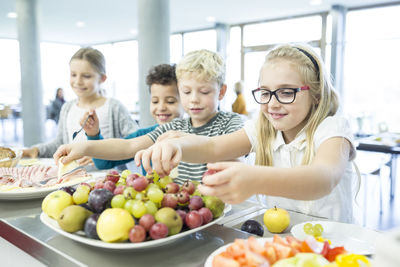 Pupils at counter in school canteen