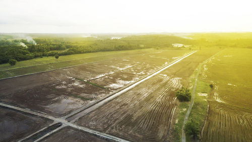 Aerial view of agricultural field against sky