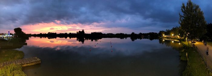 Panoramic view of lake against sky at sunset