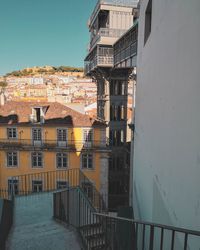 Buildings in town against sky