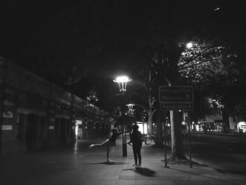 Blurred motion of people in city at night