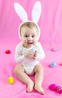 Portrait of cute girl playing with toys