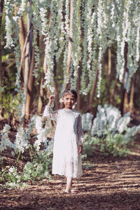 Portrait of girl walking in forest