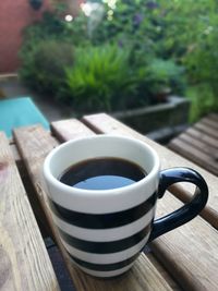 Close-up of coffee cup on table