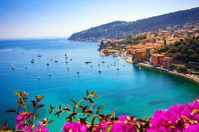 Scenic view of sea against clear blue sky