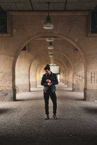 Full length of man standing on footpath