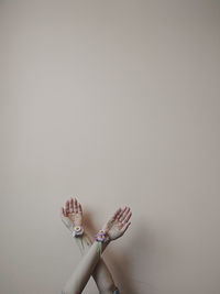 Cropped hand of woman holding flower