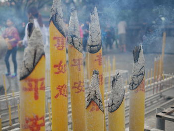 Close-up on incense sticks burning at temple