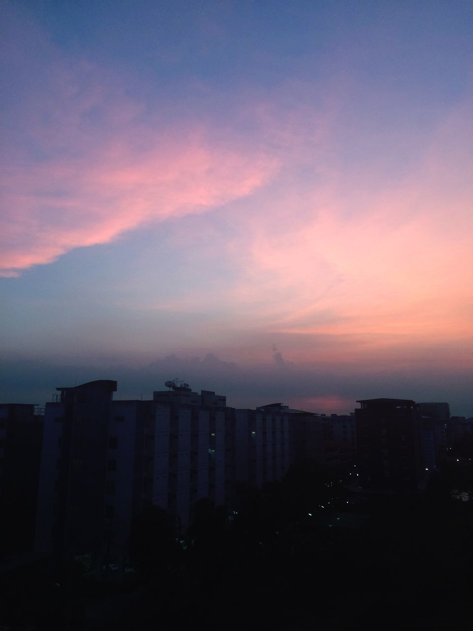 CITYSCAPE AGAINST SKY DURING SUNSET