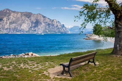 Scenic view of sea and mountains against sky