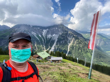 Portrait of man against mountain range