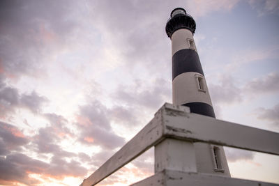 Low angle view of lighthouse against sky during sunset