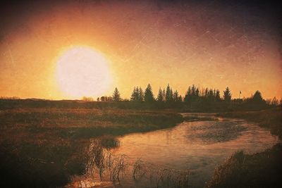 Scenic view of landscape at sunset