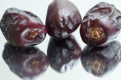 Close-up of fruits against white background