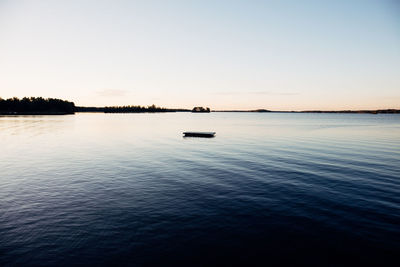 Scenic view of sea against clear sky during sunset