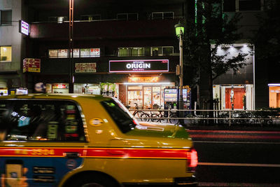 Cars on street in city at night