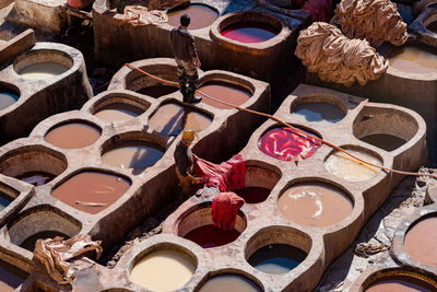 High angle view of workers dying textiles in town