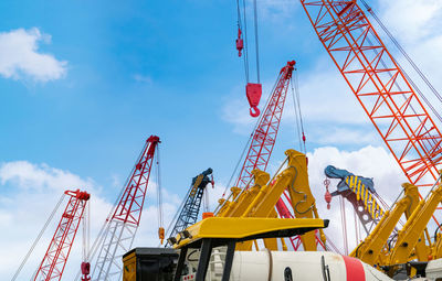 Crawler crane against blue sky. real estate industry. red crawler crane use reel lift up equipment