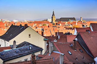 High angle view of buildings in town against sky