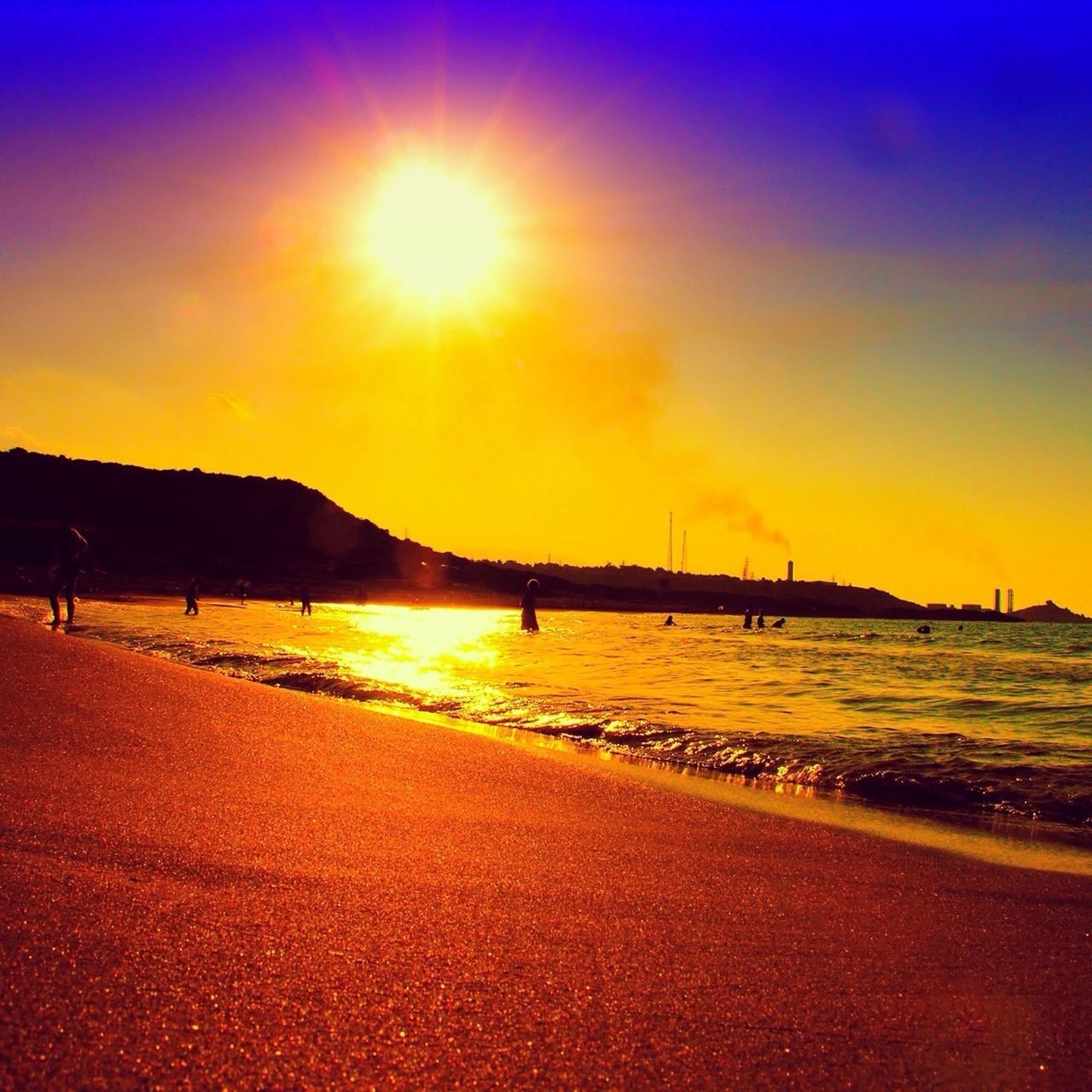 sunset, beach, sea, water, sun, sand, scenics, shore, tranquil scene, sky, beauty in nature, tranquility, sunlight, incidental people, nature, idyllic, orange color, sunbeam, silhouette, lens flare