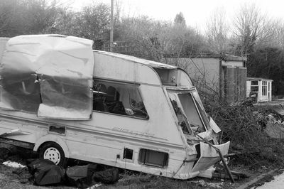 Abandoned vehicle on tree